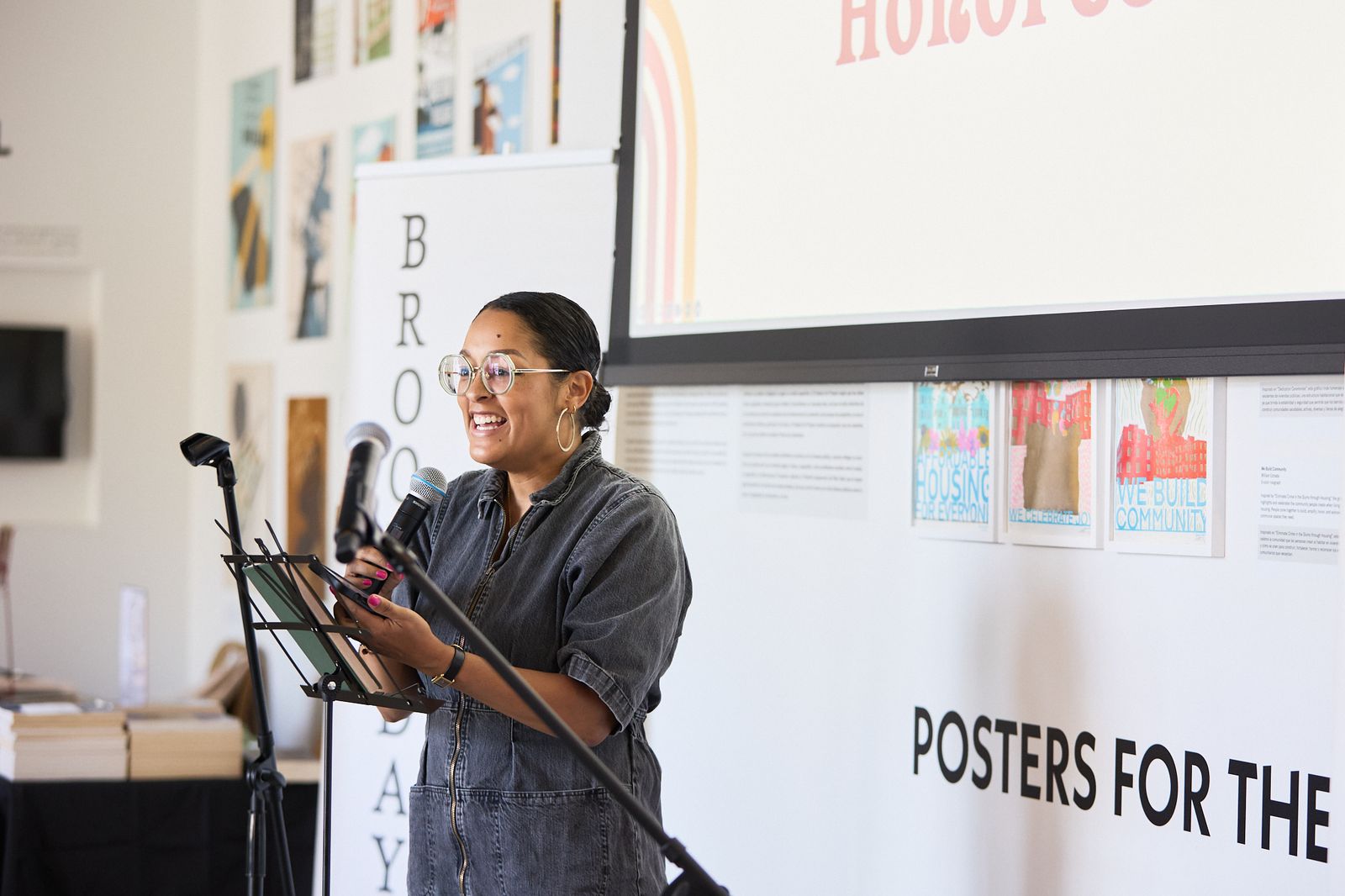 Writer Eve Ewing speaking into a microphone at a BrooksDay event.