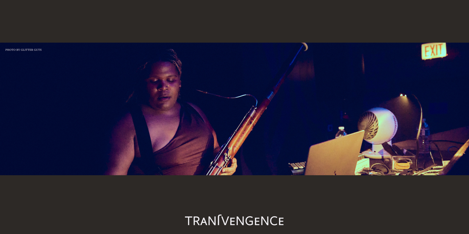 Photo by GlitterGuts of bassoonist and artist at DJ book for Transvengence event